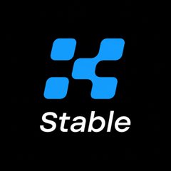 The image displays a logo featuring a stylized blue "X" symbol above the white text "Stable" on a black background, representing XStableAI. This branding aligns with the announcement that XStableAI is expanding onto the $SUI blockchain by integrating precious metals and Forex markets for decentralized finance.