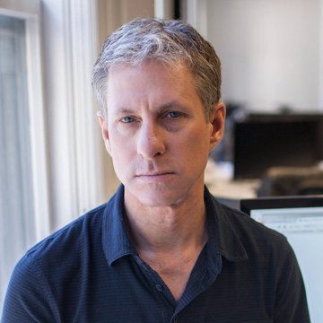 The image features a man wearing a blue shirt with white stripes sitting at his desk in front of a computer monitor. The background shows a window that allows natural light into the room. There are two computer monitors present, one located behind the man's head and another on the right side of the frame. A keyboard is also visible near the center of the image.

The post includes an interesting fact about Ripple, which is a cryptocurrency exchange platform founded by Chris Larsen in 2013. The post mentions that Ripple sent Bitcoin instantly through its network instead of waiting for block confirmations, revolutionizing the way transactions are processed and recorded on the blockchain.