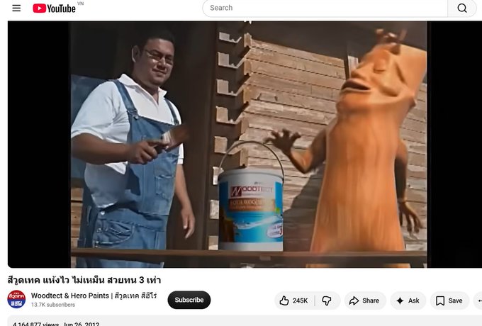 The image shows a YouTube thumbnail from the channel "Woodtech & Hero Paints" featuring a man in denim overalls pouring "Woodtech Wood Finishes" paint onto another person in an orange outfit, with Thai text reading "สวอตเทค แข่งไว ไม่แม่น สวอหน 3 เท่า." The accompanying post humorously draws a parallel between the absurd, meme-like paint-pouring scene and the speculative nature of meme coin investing, suggesting a Pepe-style memecoin ($TOAD) could emerge as a nostalgic "OG" response in an AI-saturated crypto landscape.