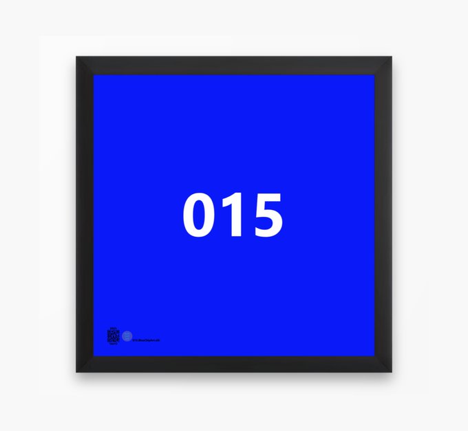 A framed blue poster displaying the white number '015' with a small logo in the bottom left corner.