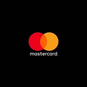 The image displays the Mastercard logo, featuring its signature red and yellow/orange overlapping circles above the lowercase "mastercard" wordmark on a black background. The logo relates directly to the announcement of Mastercard's acquisition of BVNK, as it represents the company expanding its digital asset payments infrastructure.