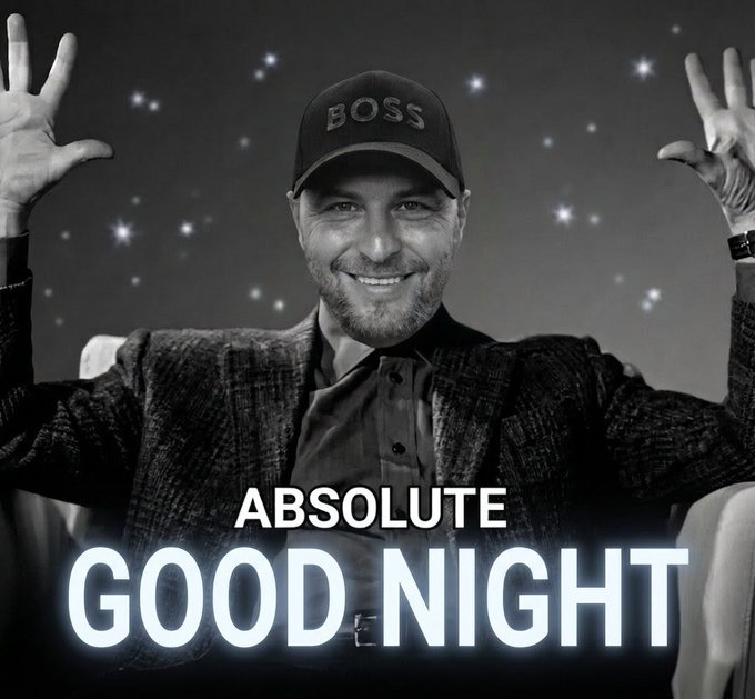 The image features a man wearing a black hat, sitting down, and smiling at the camera. The caption of the image reads "Good Night Absolute Good Night" with a logo for a website or social media account.