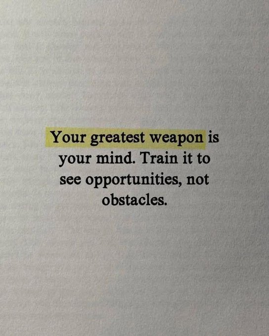 A motivational quote on white paper with the first part highlighted in yellow: 'Your greatest weapon is your mind. Train it to see opportunities, not obstacles.'