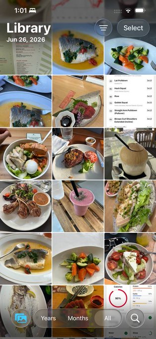 A screenshot of an iPhone Photos app showing a "Library" grid of food photos dated "Jun 26, 2026," featuring various healthy meals like grilled fish, steak with vegetables, salads, wraps, and coconut water, with a visible food list including items like "1/2 Pulled Pork," "Fresh Bison," and "Grilled Steak Salad." The image visually supports the post's claim about maintaining a clean, whole-food diet for a year to improve health markers.