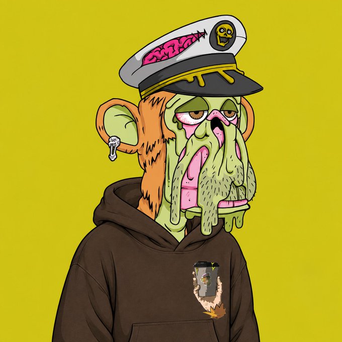 A cartoon illustration features a grotesque, drooling monkey-like creature wearing a captain's hat and brown hoodie against a yellow background, with a small graphic on the chest.