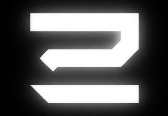 A stylized white logo or letter design on a black background.