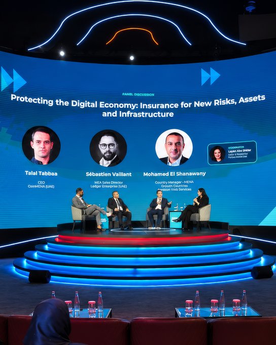 A panel discussion titled 'Protecting the Digital Economy: Insurance for New Risks, Assets and Infrastructure' featuring Talel Tabbaa, Sébastien Vaillant, Mohamed El Shanawany, and moderator Layla Abi Haidar.