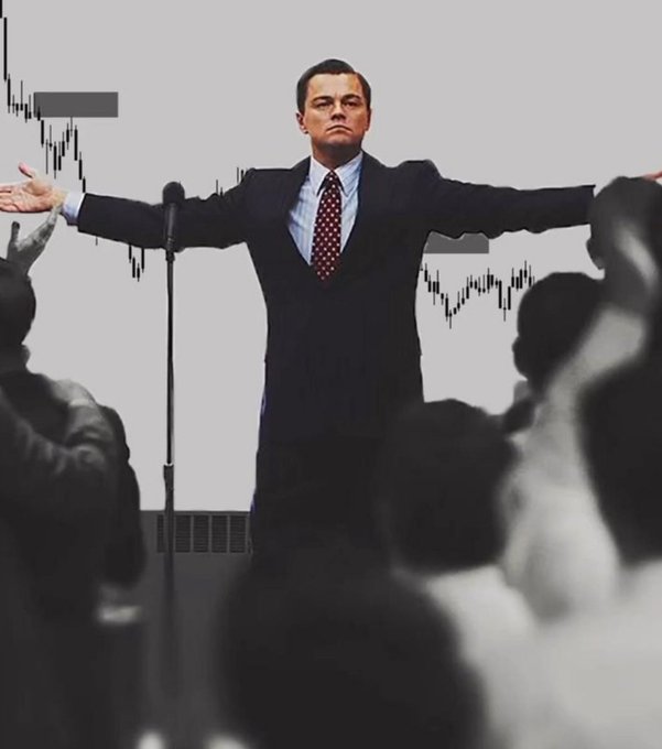Leonardo DiCaprio's iconic "I'm flying" pose from *The Wolf of Wall Street* is juxtaposed with descending stock chart candles in the background, humorously greeting traders with a deflating market backdrop.