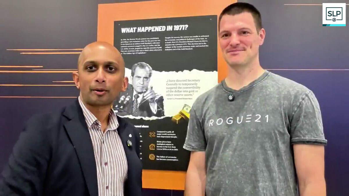 In the image, there are two men standing next to each other against a purple background with white text. One of them is wearing a gray shirt that says "ROGUE21", while the other man has a bald head and is dressed in a suit. They appear to be posing for a photo or participating in an event related to Bitcoin, as indicated by the accompanying post on Twitter. The post features a picture of a man with a bald head wearing a suit, along with some text that reads "What's strange about Bitcoiners is that they want to borrow stablecoins, but pay back in BTC. So we had to fix that. With @stephanlivera Philipp @bonomat explains how this user behavior led us to create non-custodial swaps between Bitcoin/Lightning and stablecoins." The image also includes a watermark of the Twitter account "stephanlivera Philipp" in the bottom right corner, which might be related to the post.