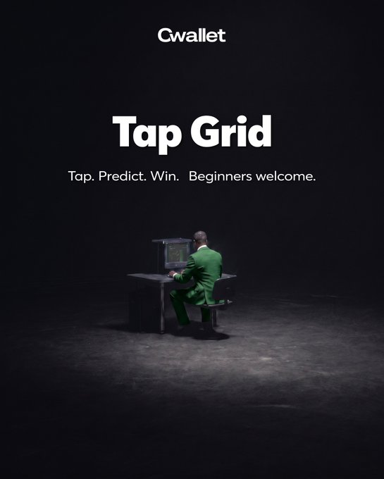An advertisement for Cwallet's 'Tap Grid' game with the tagline 'Tap. Predict. Win. Beginners welcome.' showing a man in a green suit sitting at a desk in a dark setting.