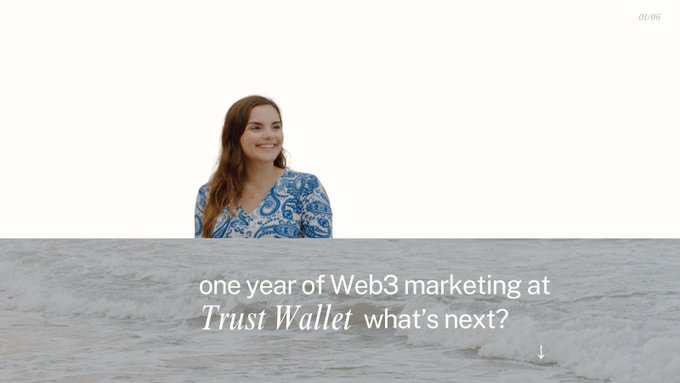 The image features a woman standing by the ocean with her back to the camera. The background of the image is white, which contrasts with the blue water surrounding the woman. Below the woman's head, there are two lines of text that read "one year of Web3 marketing at Trust Wallet what's next?".