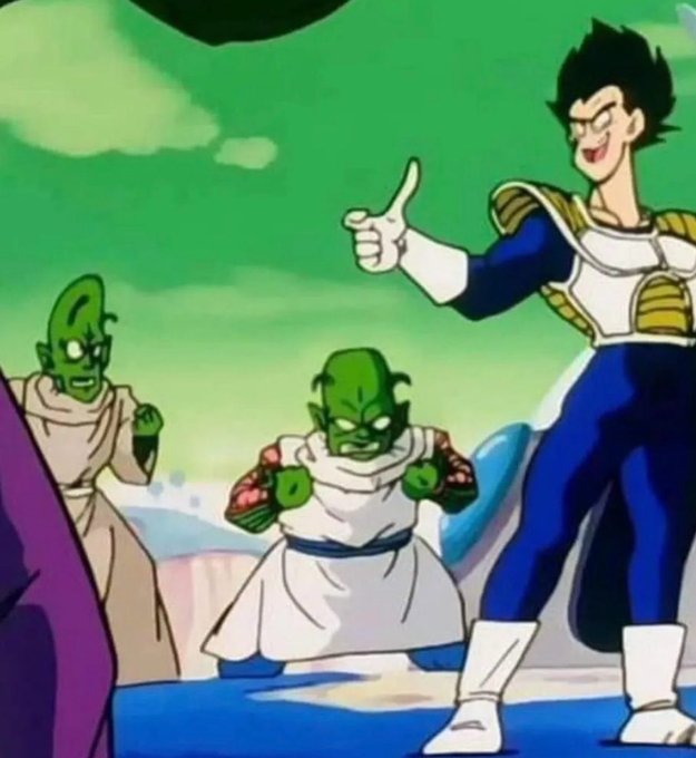 A scene from the Dragon Ball Z anime showing Vegeta giving a thumbs-up alongside two Namekian characters in white robes.