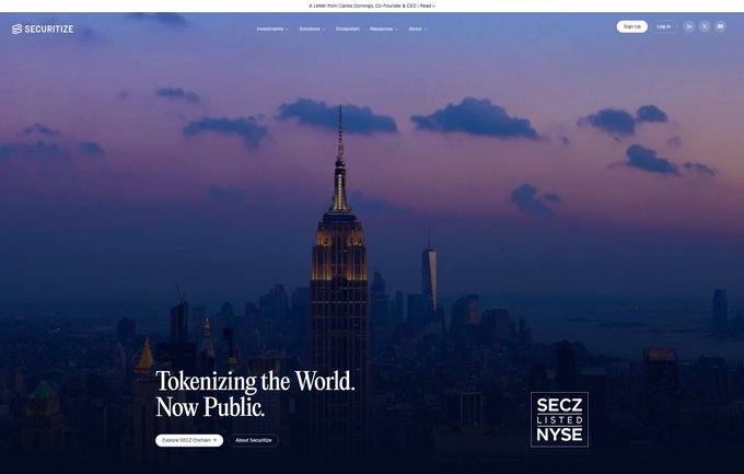 The image shows the homepage of Securitize, a tokenization company, featuring a New York City skyline at dusk with the Empire State Building prominently displayed. Key text includes "Tokenizing the World. Now Public," "SEC2 LISTED NYSE," and "Explore SEC2 Onramp" and "About Securitize" buttons, highlighting the company's recent public listing on the NYSE as a SEC2 ticker. This relates to the post about Ripple's investment in Securitize, illustrating the tokenization infrastructure that Ripple is helping build beyond just promoting XRP.