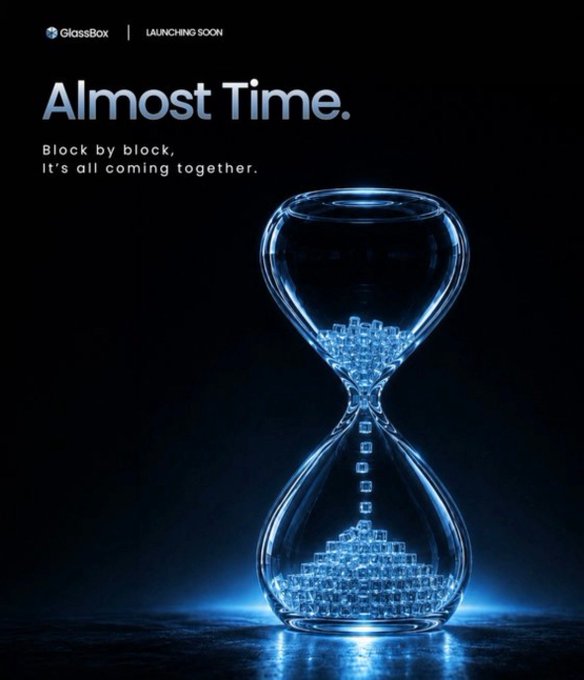 A GlassBox 'Launching Soon' promotional poster titled 'Almost Time. Block by block, It's all coming together,' featuring an hourglass filled with glowing blue cubes.