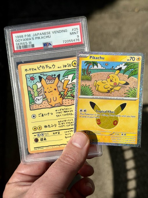 A hand holds two PSA-graded Pikachu Pokemon cards, including a 1998 PM Japanese Vending Series III #25 Mint 9 graded card and a Tropical Vibes card from McDonald's 2025.