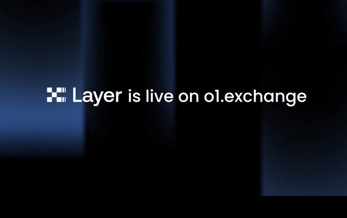 A dark promotional graphic with the text 'Layer is live on o1.exchange' alongside a pixelated logo icon.