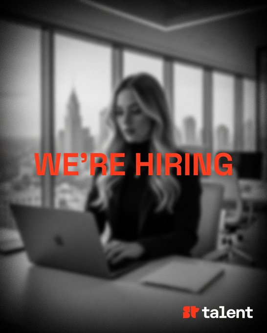 A black-and-white 'WE'RE HIRING' recruitment ad featuring a woman working on a laptop with a city skyline in the background, branded with the Talent logo.