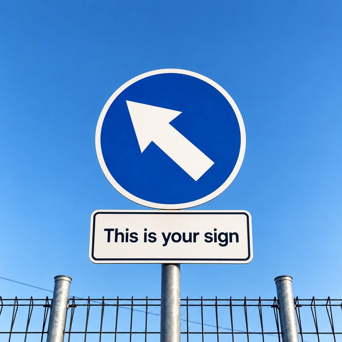 A blue directional arrow sign and a white placard reading "This is your sign" are mounted on a pole against a clear sky, literally illustrating the accompanying message about paying attention to signs. The straightforward wordplay visually reinforces the post's invitation to notice meaningful cues in everyday life.