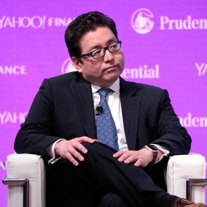 A man in a pinstripe suit and glasses sits on stage at a Yahoo Finance event with Prudential branding visible in the purple backdrop. The image likely depicts a financial commentator or executive discussing BitMine's (BMNR) rapidly growing cash reserves and recent Ethereum (ETH) accumulation, as outlined in the post detailing the firm's 76% cash increase and ongoing crypto purchases.