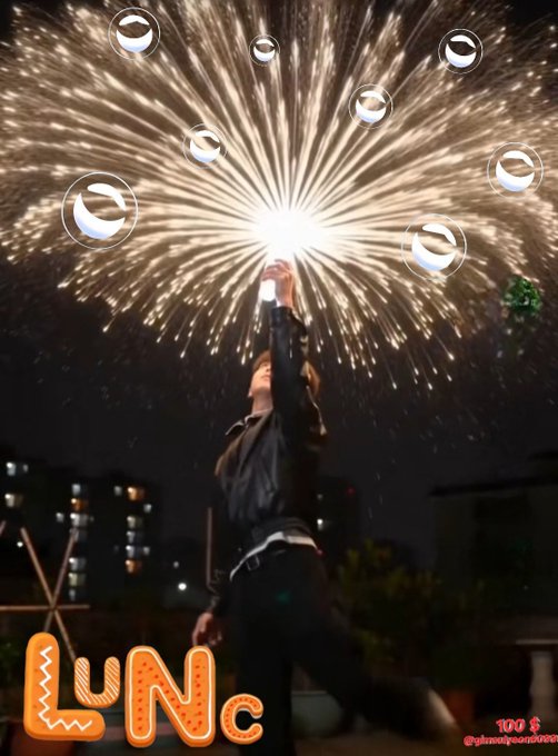 A person reaches upward toward a spectacular burst of fireworks in the night sky, with multiple cryptocurrency token logos floating around them; 'LUNC' branding with '100 $' is displayed in the corner.