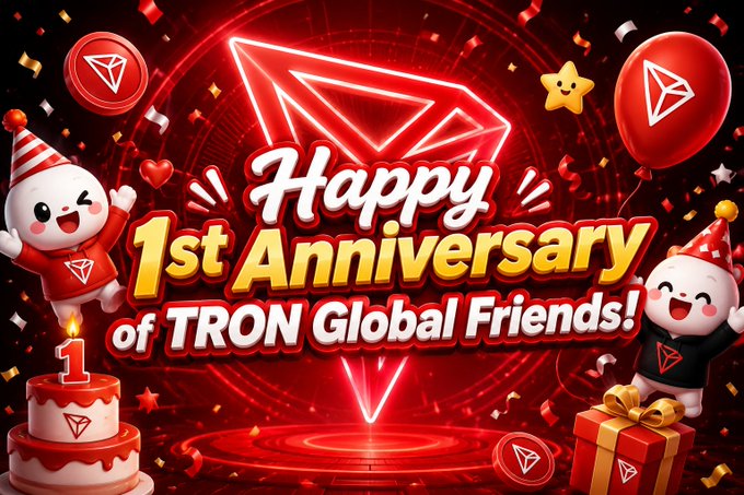 The image features a celebratory scene with two cartoon characters wearing party hats, surrounded by red balloons and confetti. The background of the image is black, which contrasts with the vibrant colors of the balloons and decorations. In the center of the image, there's a banner that reads "Happy 1st Anniversary of TRON Global Friends".