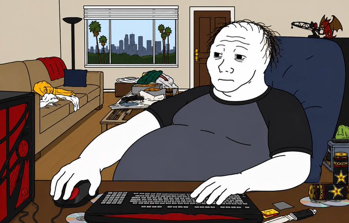 A cartoon drawing of a pale, balding man in a black t-shirt sitting at a computer desk with an energy drink and scattered items.