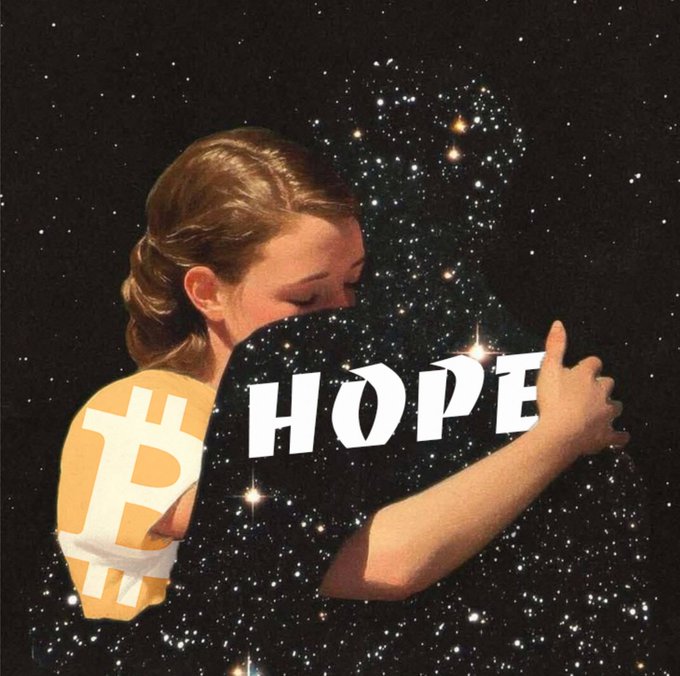 An artistic image of a person hugging a figure made of stars and space, with the word 'HOPE' across the front and a Bitcoin symbol on the shoulder.