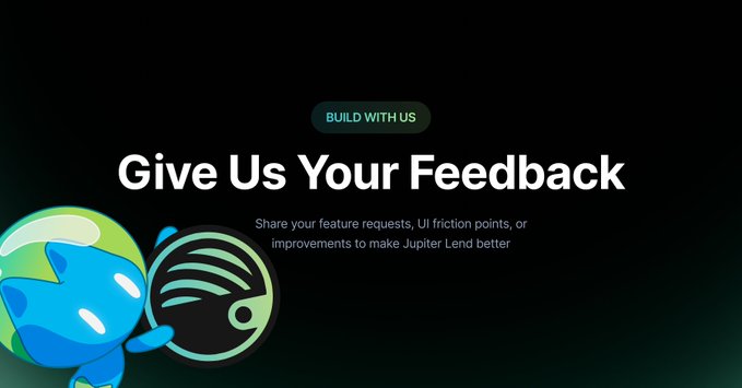 A dark-themed feedback page displays the headline "Give Us Your Feedback" beneath a green "BUILD WITH US" badge, with a subtitle inviting users to share feature requests, UI friction points, or improvements to make Jupiter Lend better. A stylized blue alien-like mascot holding a circular planet icon appears on the left, visually reinforcing Jupiter's branding in line with the call to action for community input on Jupiter Lend.