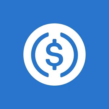 A blue logo featuring a white circle with a dollar sign ($) inside parentheses, representing the USDC cryptocurrency.