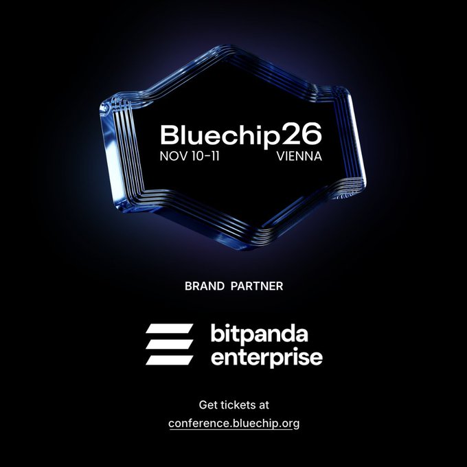A promotional image for Bluechip26 (Nov 10-11, Vienna) featuring the "Bluechip26" logo inside a glass-like hexagonal badge, announcing Bitpanda Enterprise as a Brand Partner with tickets available at conference.bluechip.org.
