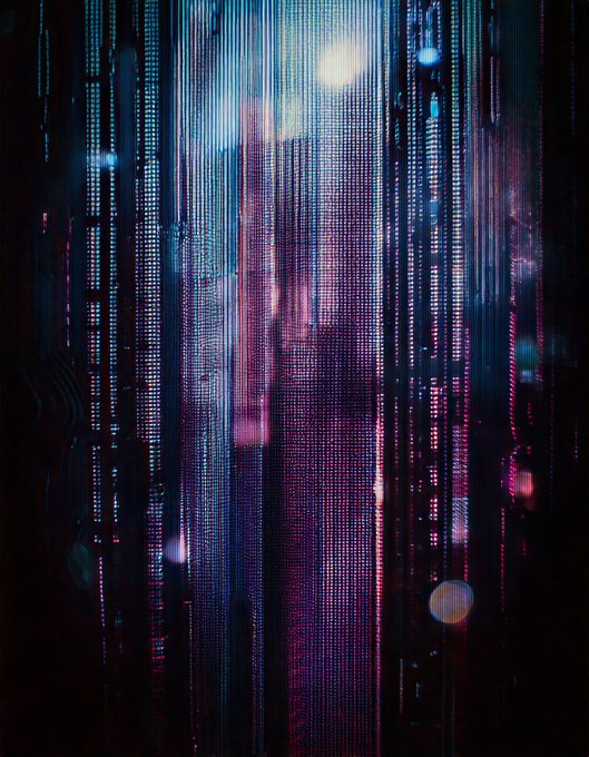 A digital glitch art composition featuring vertical streams of blue, pink, and magenta pixelated light against a dark background, with bokeh orbs scattered throughout. The image visually echoes the post's "Coming Through" caption through its sense of light piercing through a fragmented, barrier-like digital veil, suggesting an emerging or breaking-through effect reminiscent of signals passing through data streams.