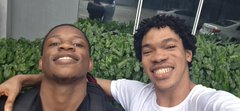 Two friends smile warmly for a selfie as they head to an NFT__NG football event together, with one tagging his buddy Romeo_Onchain on their outing.