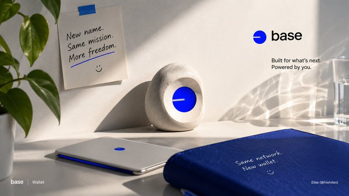 A promotional image for Base Wallet featuring a concrete-like circular device with a blue indicator, alongside notebooks and a sticky note reading 'New name. Same mission. More freedom.', with text 'base' and 'Built for what's next. Powered by you.'