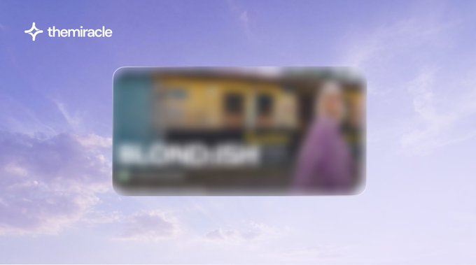 A blurred thumbnail-style image with the logo 'themiracle' in the top left corner, set against a purple sky background.
