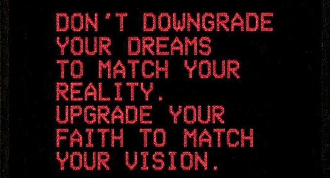 The image features a black background with red text that reads "Don't downgrade your dreams to match your reality, upgrade your faith to match your vision." The words are written in a blocky font style, which gives them an artistic appearance. The image also includes a small logo of the @doginaldogs website and a reference to KingAnt's work for @doginaldogs.