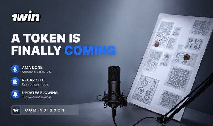 A promotional graphic for 1win announcing an upcoming token launch, featuring the text "A TOKEN IS FINALLY COMING" alongside bullet points stating "AMA DONE - Questions answered," "RECAP OUT - Key updates inside," and "UPDATES FLOWING - The roadmap is clear," with a professional microphone and storyboard visible against a dark background. The "COMING SOON" label at the bottom reinforces the teaser nature of the announcement, matching the post's message about the calm before the token drop.