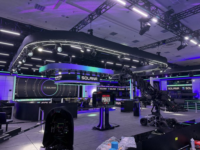 A high-tech broadcast studio branded with "SOLANA" logos features dramatic purple lighting and professional camera equipment, with a central podium displaying "POKER" branding — fitting the "Tokabu coded" caption as it showcases the intersection of crypto culture and streaming entertainment.