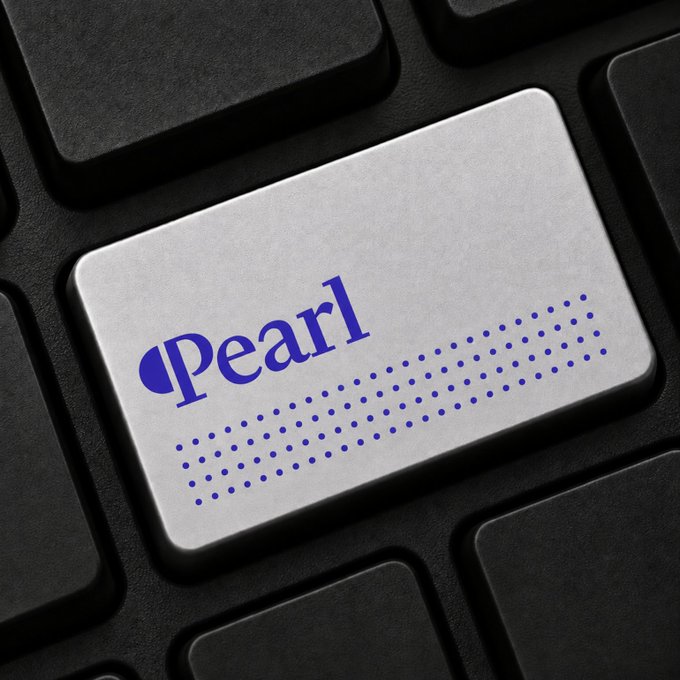 A close-up of a silver keyboard key labeled "Pearl" in blue text, surrounded by black keys. The image visually reinforces the post's focus on $PRL (Pearl), a crypto project, with the keyboard key serving as a metaphor for digital access or investment entry points into the Pearl ecosystem.