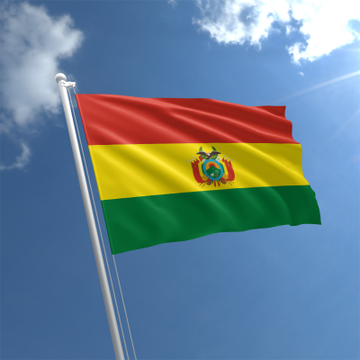The Bolivian flag waves against a bright blue sky, symbolizing the nation's exploration of integrating USDT into its official payment system following a significant rise in cryptocurrency usage. This visual ties directly to the news of Bolivia considering formal adoption of the stablecoin alongside the dollar and the boliviano.
