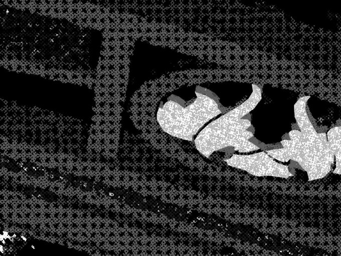 A high-contrast, heavily processed black-and-white image of a sleeping cat curled up, distorted by a pixelated or halftone filter effect.