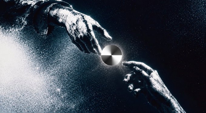 Two arms reach toward each other in a cosmic, dark setting, their fingers nearly touching around a glowing metallic sphere, evoking a sci-fi or surreal atmosphere.