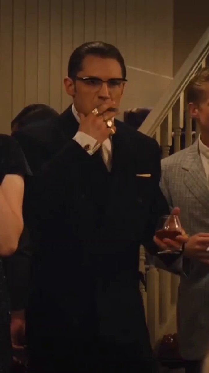 The image shows a man dressed in a suit, smoking a cigarette while standing next to stairs. The scene takes place at an event where people are gathered around him. There's also another person holding a glass of wine nearby. The post about Bitcoin addresses the current state of the cryptocurrency market and mentions that only the Ninjas are celebrating right now. This implies that the value of Bitcoin is high, which could be due to its association with the Ninjas' culture or some other factors not visible in the image.

The man smoking a cigarette might represent an older, more traditional approach to celebrating, while the person holding wine could symbolize a more modern and sophisticated celebration style. The contrast between these two elements adds depth to the scene and highlights how different generations can have varying perspectives on events or situations.