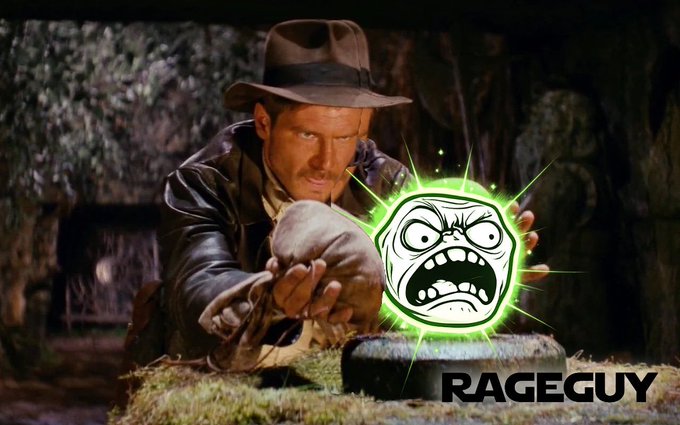 urn of fire, with a green face and red eyes, is held by a man in a brown hat and leather jacket, set against a dark background.