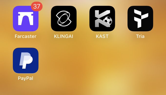 The image shows a row of mobile app icons on an orange background, including Farcaster (with a "37" notification badge), KLINGAI, KAST (featuring a soccer ball design in the updated logo), Tria, and PayPal. The KAST app icon's refresh aligns with the post celebrating its new logo redesign, while the soccer ball imagery ties into the user's 2026 World Cup match prediction between Norway and France.