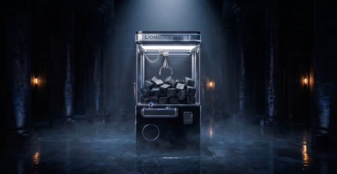 The image features a toy claw machine with a large pile of coal inside, which has been used as an advertisement for a new product or service. The scene takes place in a dark room, possibly a museum or a themed event space, adding to the overall atmosphere and intrigue surrounding the toy claw machine. The caption provided after the image highlights that this is the first time such a collectible item has been showcased on a movie poster, indicating its novelty and uniqueness.