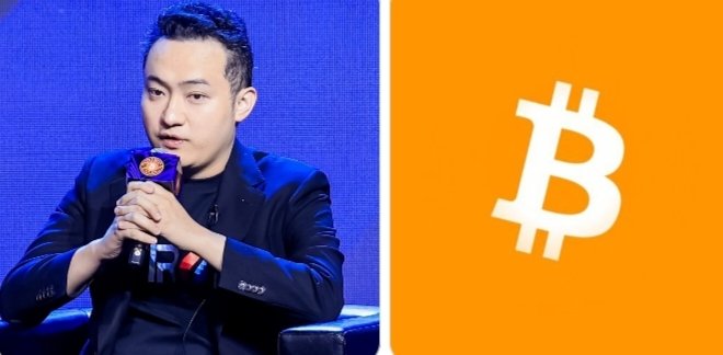 A man in a dark blazer speaks into a microphone against a blue background, paired with an orange panel displaying the white Bitcoin '₿' symbol.