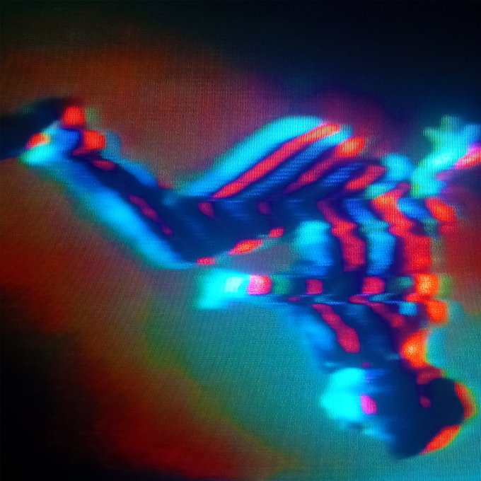 The image shows a distorted, glitchy abstract figure rendered with vibrant cyan, blue, and green colors on a dark reddish background, appearing to depict a falling or tumbling form through a hazy, digital artifact effect. It visually echoes the accompanying post's phrase "I fall when I fly," conveying a sense of chaotic motion, disorientation, and the fragile, unstable boundary between ascent and descent.