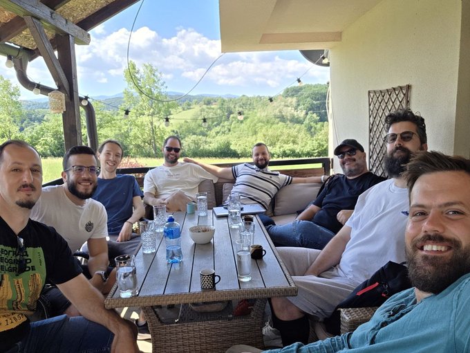 The image shows a group of men sitting at an outdoor table with drinks, enjoying each other's company. The scene takes place on a porch or patio area, providing a relaxed atmosphere for their gathering. There are several people seated around the table, engaged in conversation and sharing stories. A few cups can be seen placed on the table as well.

The post seems to be discussing privacy, transactions, user experience, and agentic payments. The men's focus is likely on these topics, possibly reflecting on their day or planning future activities together.