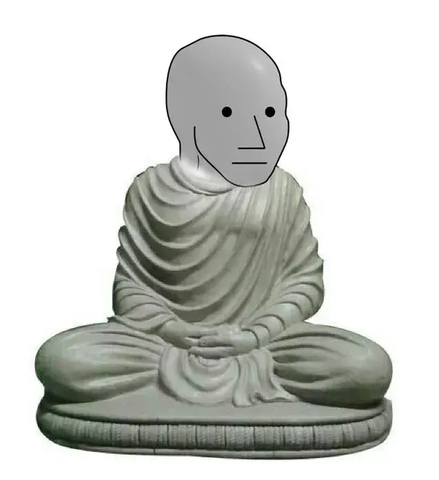 The image features a gray statue of Buddha sitting cross-legged with his hands folded together at his sides. A face is drawn over the Buddha's head, giving him a cartoonish appearance. The caption below the image reads "I think, therefore I am $NPC". This phrase adds an element of humor and playfulness to the scene, suggesting that the Buddha statue might be associated with a character or persona named $NPC.