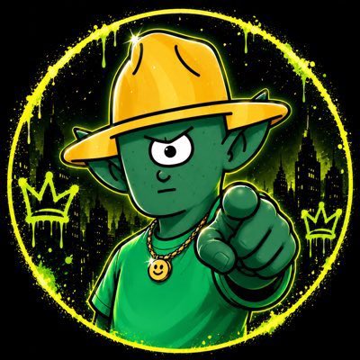 An illustrated green goblin-like character with one large eye wears a yellow bucket hat and points forward, surrounded by a yellow splatter circle and small crown graphics.